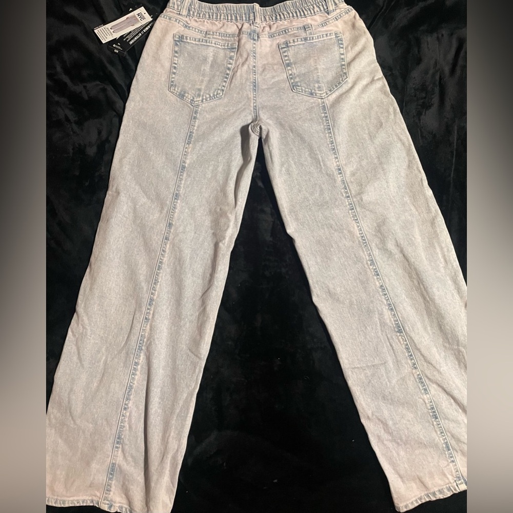 Wide-Leg Blue Jeans With A Pink Hue